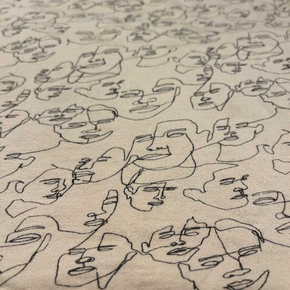 Dedicated 100% Organic Cotton squiggle face print  in cream.